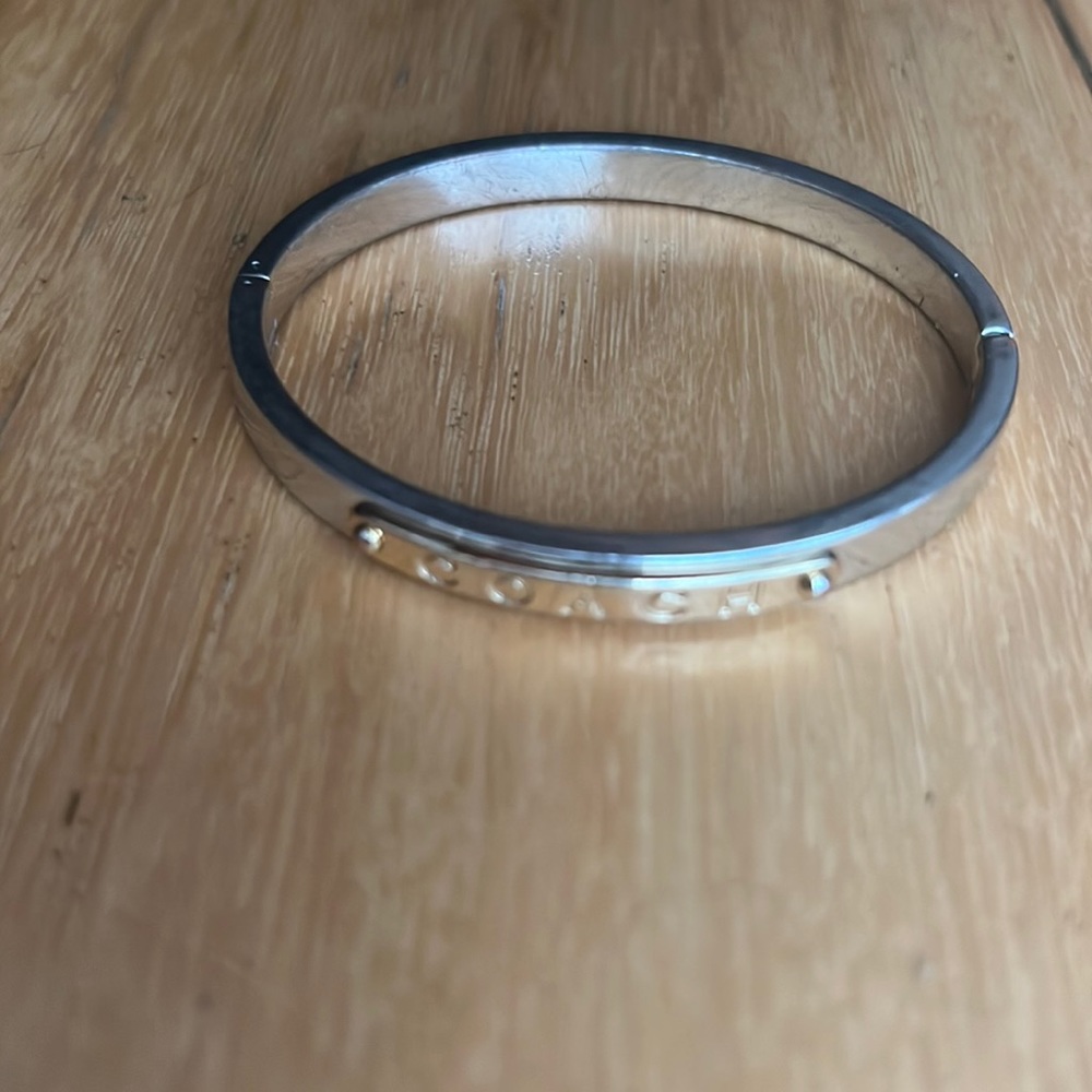 Silver and gold Coach bangle